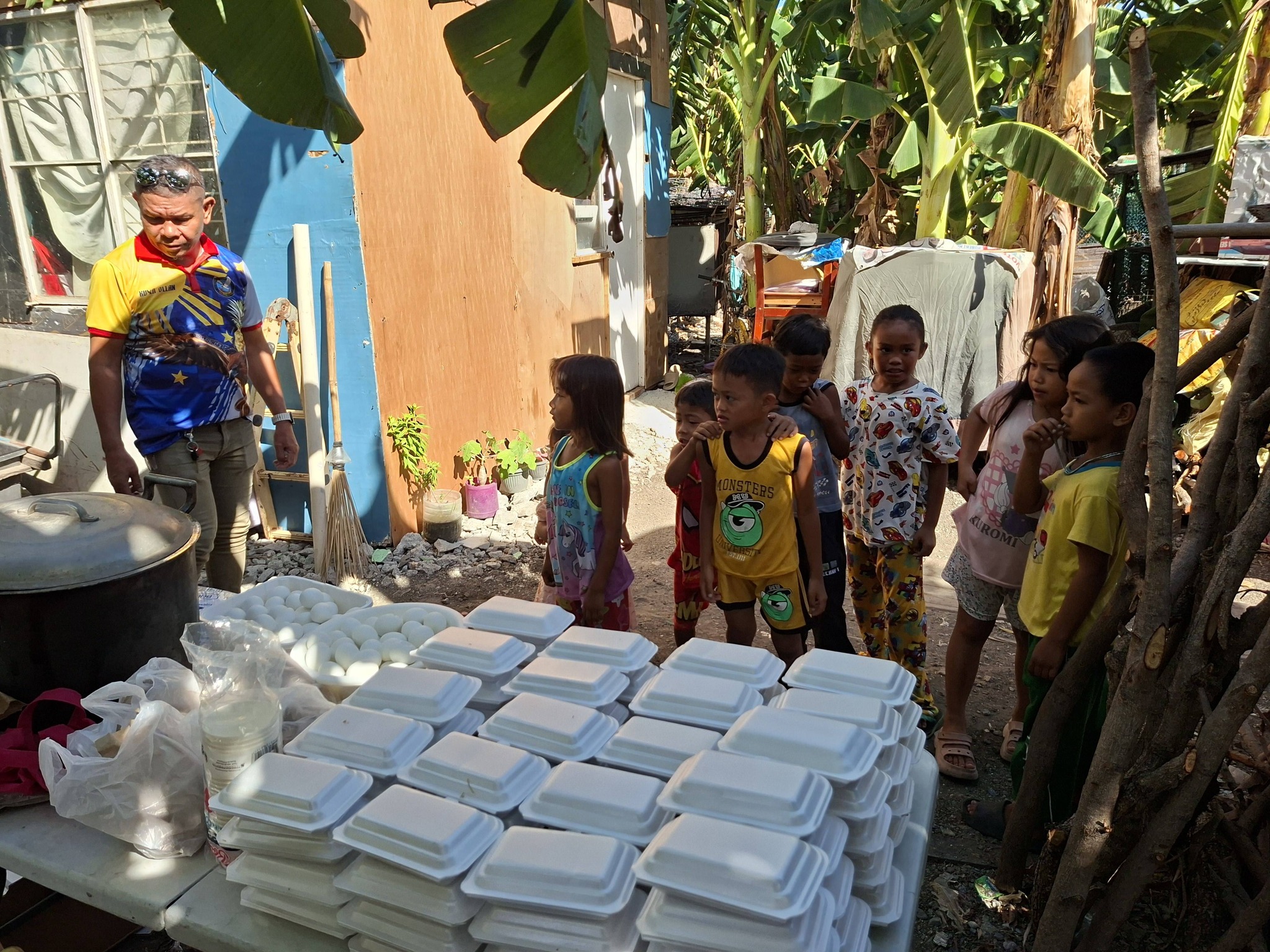 Bandila Eagles Club feeding program at Alapan 2A, Imus Cavite.